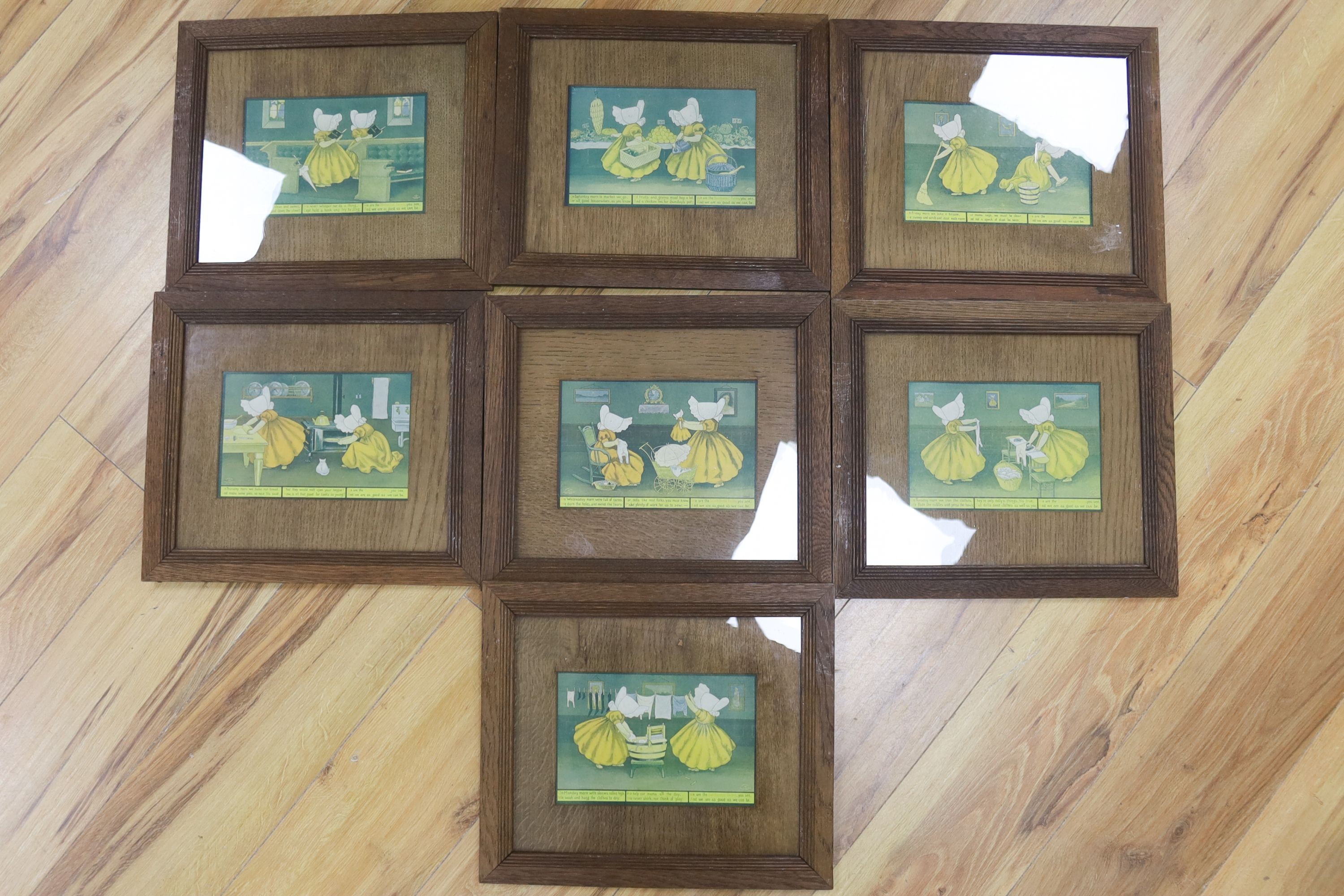 A set of seven sunbonnet twins oak framed 'days of the week' litho prints copyright 1905 by the Ullman mfg Co. New York